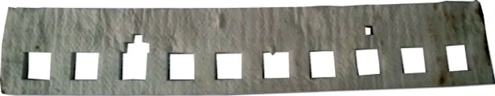 Wärmedämmung aus weißem Material mit mehreren rechteckigen Ausschnitten, geeignet für Brennerplatten, von der Marke Wolf.